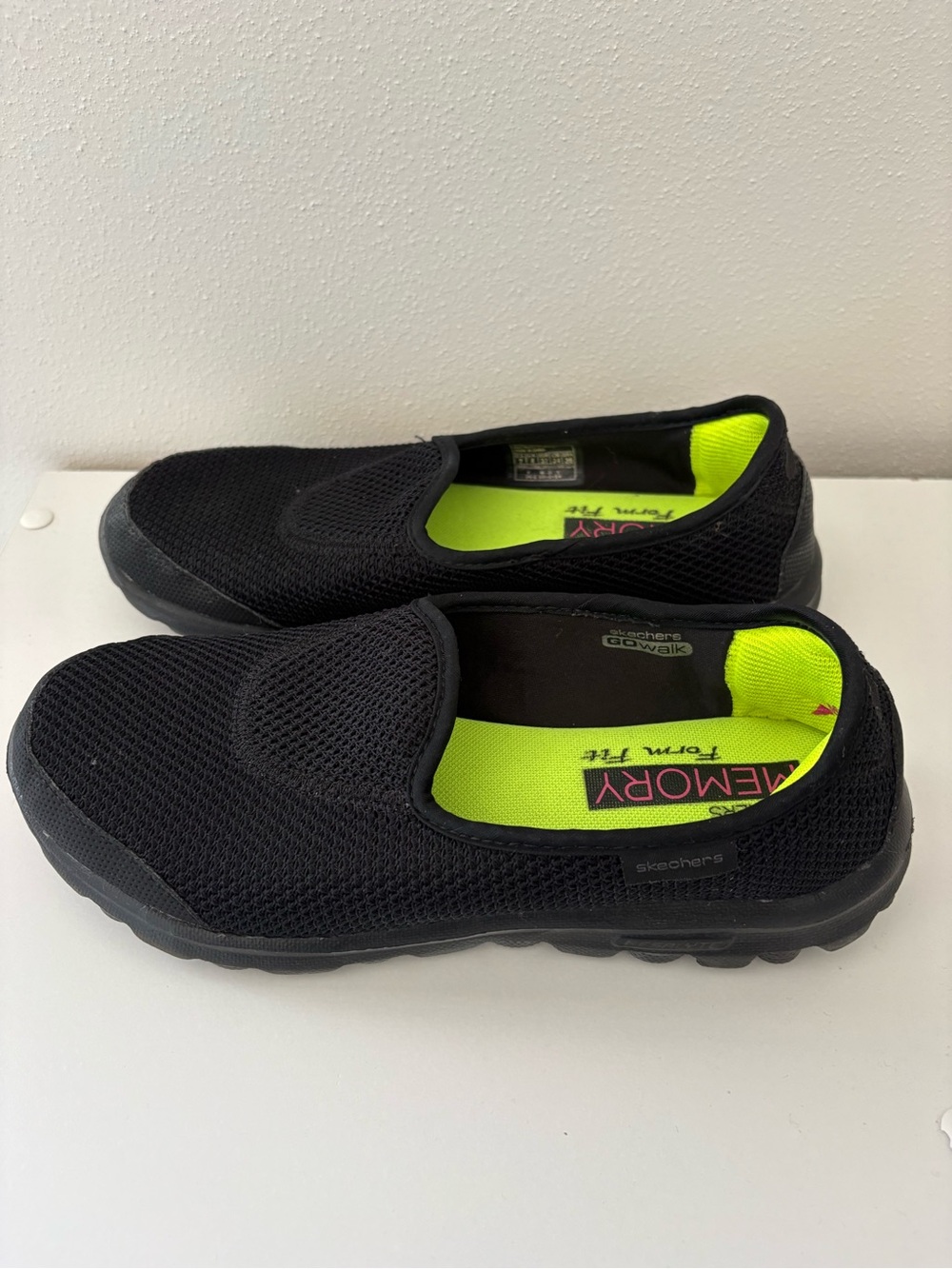 Skechers Black Slip-On Sneakers with Neon Yellow-Green Insole